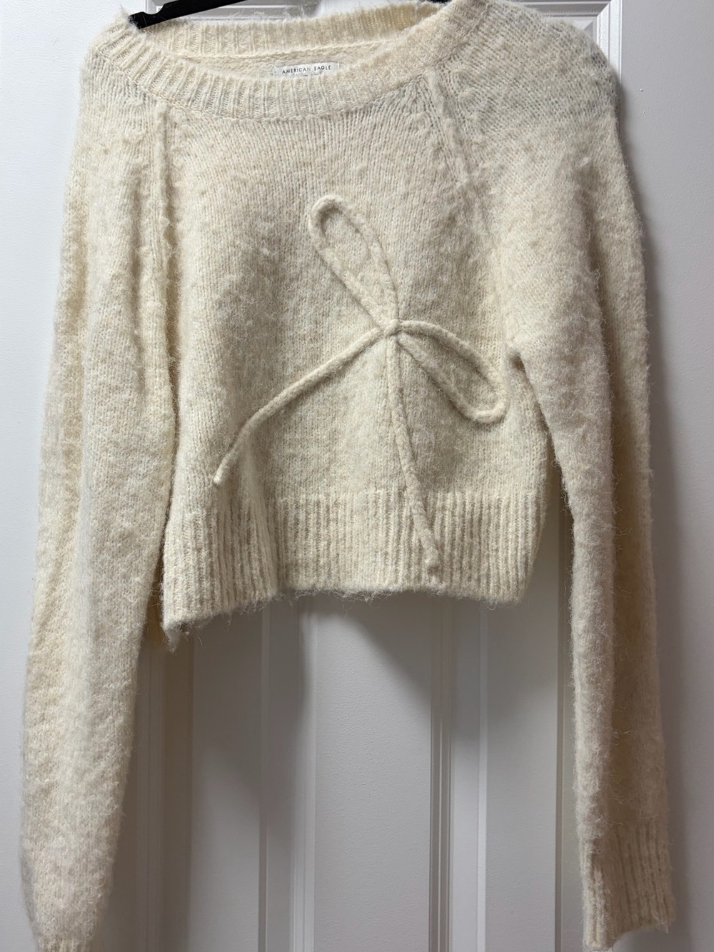 American Eagle Outfitters Cream Bow-Front Fuzzy Crewneck Sweater